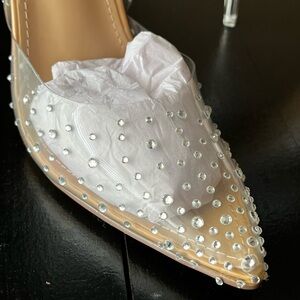 These dressy clear shoes have never been worn.